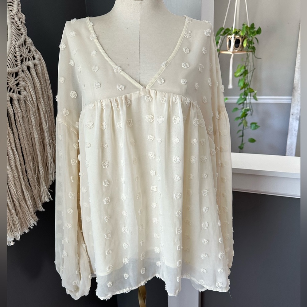 Entro flowy boho blouse with pretty polka dot details.